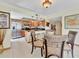 Open dining area with kitchen and stainless steel refrigerator at 1400 Gulf Blvd # 204, Clearwater Beach, FL 33767