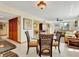 Dining area with a glass table and seating for four near the living area at 1400 Gulf Blvd # 204, Clearwater Beach, FL 33767