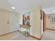 Inviting entryway featuring neutral decor, tile flooring, and a charming accent table with floral artwork at 1400 Gulf Blvd # 204, Clearwater Beach, FL 33767