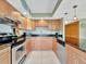 Updated kitchen featuring stainless steel appliances, granite counters, and modern cabinetry at 1400 Gulf Blvd # 204, Clearwater Beach, FL 33767