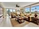 Bright living room with large windows and comfortable seating at 1400 Gulf Blvd # 204, Clearwater Beach, FL 33767