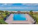 Swimming pool surrounded by lush landscaping and lounge chairs with beach views at 1400 Gulf Blvd # 204, Clearwater Beach, FL 33767