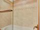 Close-up of a shower featuring tiled walls, glass door, and modern fixtures at 1400 Gulf Blvd # 204, Clearwater Beach, FL 33767