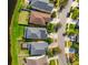 Aerial view of a neighborhood showcasing well-maintained homes, lawns, and streets at 18855 Hampstead Heath Ct, Land O Lakes, FL 34638
