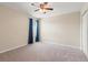 Bedroom with neutral carpet, ceiling fan, and window with blinds at 18855 Hampstead Heath Ct, Land O Lakes, FL 34638