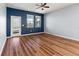 Empty bedroom with wood flooring, ceiling fan and lots of natural light at 18855 Hampstead Heath Ct, Land O Lakes, FL 34638