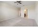 Spacious bedroom with carpet flooring leads to the ensuite bathroom at 18855 Hampstead Heath Ct, Land O Lakes, FL 34638