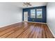 Empty bedroom with wood floors, ceiling fan and lots of natural light at 18855 Hampstead Heath Ct, Land O Lakes, FL 34638