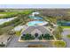 Aerial view of the community center featuring a pool, tennis court, and recreational area at 18855 Hampstead Heath Ct, Land O Lakes, FL 34638