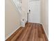 Elegant foyer with wood floors and a classic white door offers a warm invitation at 18855 Hampstead Heath Ct, Land O Lakes, FL 34638