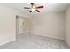 Room with carpet, ceiling fan, and entry to other rooms at 18855 Hampstead Heath Ct, Land O Lakes, FL 34638