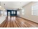 Spacious living room with wood floors, neutral walls, and plenty of natural light at 18855 Hampstead Heath Ct, Land O Lakes, FL 34638
