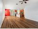 Bright living room with hardwood floors flows into the kitchen area at 18855 Hampstead Heath Ct, Land O Lakes, FL 34638