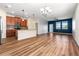 Spacious open-plan living area featuring wood flooring, and lots of natural light at 18855 Hampstead Heath Ct, Land O Lakes, FL 34638
