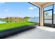 Screened patio with a view of the lush backyard and serene pond at 18855 Hampstead Heath Ct, Land O Lakes, FL 34638