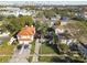 Aerial view of a residential street showcasing well-maintained homes, lush trees, and proximity to the city skyline at 308 S Arrawana Ave, Tampa, FL 33609
