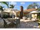 Backyard patio with outdoor dining and lounge areas at 308 S Arrawana Ave, Tampa, FL 33609
