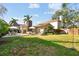 Spacious backyard with outdoor seating and mature landscaping at 308 S Arrawana Ave, Tampa, FL 33609