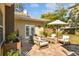 Charming backyard patio with outdoor seating, great for entertaining at 308 S Arrawana Ave, Tampa, FL 33609