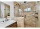 Bright bathroom featuring modern shower with tan tile and glass door at 308 S Arrawana Ave, Tampa, FL 33609
