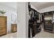 Bright bathroom featuring an organized walk-in closet and double sink vanity at 308 S Arrawana Ave, Tampa, FL 33609