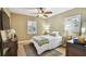 Cozy bedroom with neutral walls, shutters, a ceiling fan, and a comfortable bed at 308 S Arrawana Ave, Tampa, FL 33609