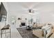 Bright living room featuring a fireplace and access to the back yard at 308 S Arrawana Ave, Tampa, FL 33609