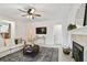 Cozy living room with a fireplace and mantle at 308 S Arrawana Ave, Tampa, FL 33609