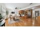 Open concept living space with beautiful hardwood floors, dining area, and an open flow to the kitchen at 308 S Arrawana Ave, Tampa, FL 33609