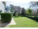 Spacious backyard with a view of the home's screened-in porch at 4037 Auston Way, Palm Harbor, FL 34685
