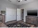 bedroom features a space themed rug, TV, and built-in storage shelves at 4037 Auston Way, Palm Harbor, FL 34685
