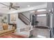 Inviting foyer with staircase, double-door entrance, high ceilings, and decorative tile flooring at 4037 Auston Way, Palm Harbor, FL 34685