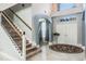 Grand foyer with soaring ceilings, a staircase, and elegant tile flooring at 4037 Auston Way, Palm Harbor, FL 34685