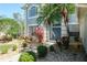 Charming front entrance with double doors, decorative plants, and stone walkway at 4037 Auston Way, Palm Harbor, FL 34685