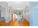 Inviting dining room open to the kitchen featuring hardwood floors, a dining table, and natural light at 5 N Jupiter Ave, Clearwater, FL 33755