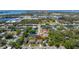 Aerial view of a lovely suburban home near a scenic body of water and green spaces at 5909 Canton S St, St Petersburg, FL 33712
