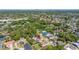 An aerial view of a property located in a lush, green suburban neighborhood at 5909 Canton S St, St Petersburg, FL 33712