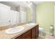 Bathroom featuring double sinks, tile floors, and neutral wall colors at 5909 Canton S St, St Petersburg, FL 33712
