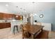 Inviting dining area with tile flooring, a wooden table, and direct access to the kitchen and dining area at 5909 Canton S St, St Petersburg, FL 33712