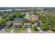 Charming two-story home with a well-manicured front lawn and a driveway, nestled in a lush, green neighborhood at 5909 Canton S St, St Petersburg, FL 33712