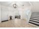 Inviting foyer with tile flooring, staircase, and a view into the living area at 5909 Canton S St, St Petersburg, FL 33712