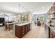 Open kitchen with breakfast bar and dining area featuring stainless steel appliances, tiled floors, and natural light at 5909 Canton S St, St Petersburg, FL 33712