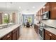 Open kitchen with modern stainless steel appliances, lots of natural light, and tile flooring at 5909 Canton S St, St Petersburg, FL 33712