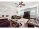 Open-concept living room featuring hardwood floors, a ceiling fan, and a view of the foyer at 5909 Canton S St, St Petersburg, FL 33712