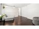 Open-concept living room featuring hardwood floors, a comfy chaise lounge, and bright recessed lighting at 5909 Canton S St, St Petersburg, FL 33712