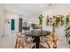Open-concept dining area with a round table, seamlessly connected to the living spaces at 6911 N 19Th St, Tampa, FL 33610