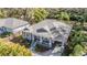 Charming gray home with a cozy front porch, carport, and manicured landscaping at 6911 N 19Th St, Tampa, FL 33610
