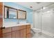 Bathroom features a new shower with updated fixtures, lighting, and vanity at 7041 73Rd N St, Pinellas Park, FL 33781