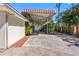 Attached carport leading to a screened pool area, offering shade and convenience at 7320 Burlington N Ave, St Petersburg, FL 33710