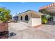 Exterior view of home with blue awnings and a side entrance, set in a well maintained yard at 7320 Burlington N Ave, St Petersburg, FL 33710